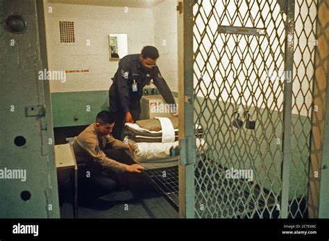 1977 A Soldier And Marine Inspect A 6 Foot Cell At The U S