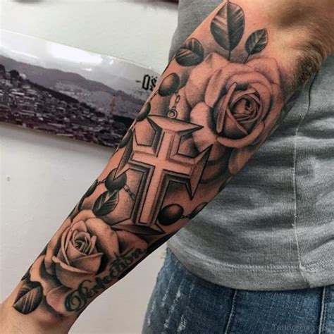 A Man Amp 39 S Arm With A Cross And Rosary Tattoo Design On The Left Forearm