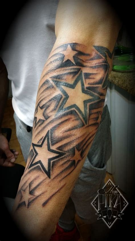 A Man S Arm With A Star Tattoo On It