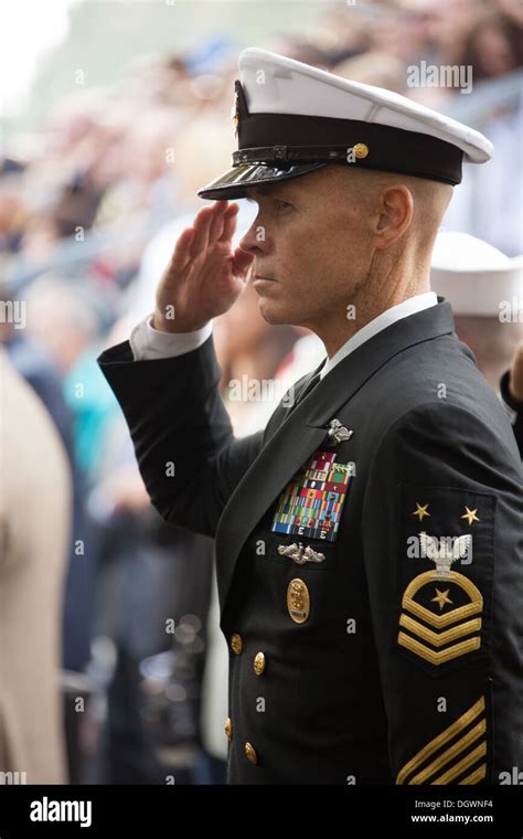 A U S Navy Master Chief Petty Officer Salutes During The National