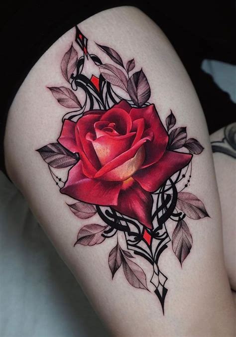 A Woman S Thigh With A Rose And Star Trek Ship Tattoo On The Side