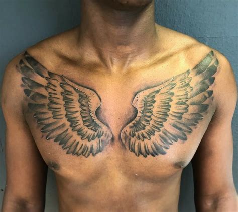 Awesome Heart And Wings Tattoo On Chest Tattoo Designs Tattoo Pictures