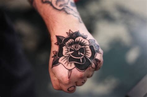 Black Traditional Rose Tattoo On The Hand Tattoogrid Net