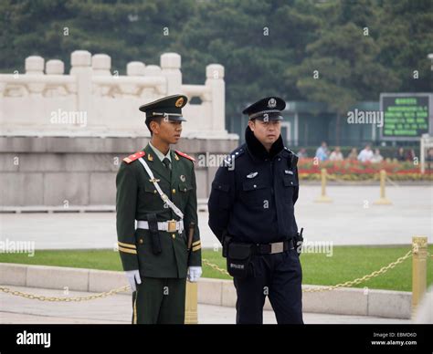 Chinese Soldier And Police Officer In Tiananmen Square Beijing China Stock Photo Alamy