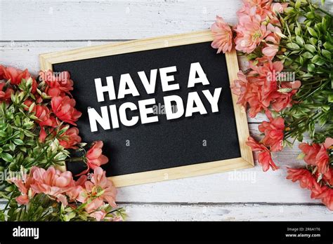 Have A Nice Day Text On Blackboard With Flower Bouquet Decoration Stock