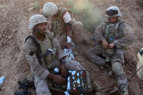 Navy Corpsmen Treating A Wounded U S Marine In Afghanistan December