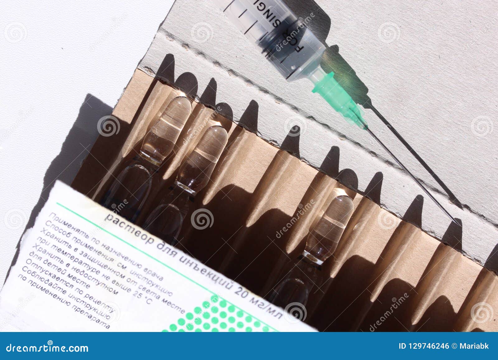 Novocaine In Ampoule In The Box And Syringe On The Table Editorial