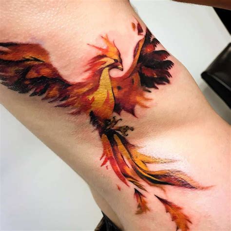 Phoenix Rising From Fire Tattoo Design