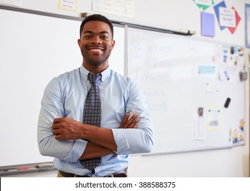 Portrait Of Confident African American Male Teacher In Class Stock