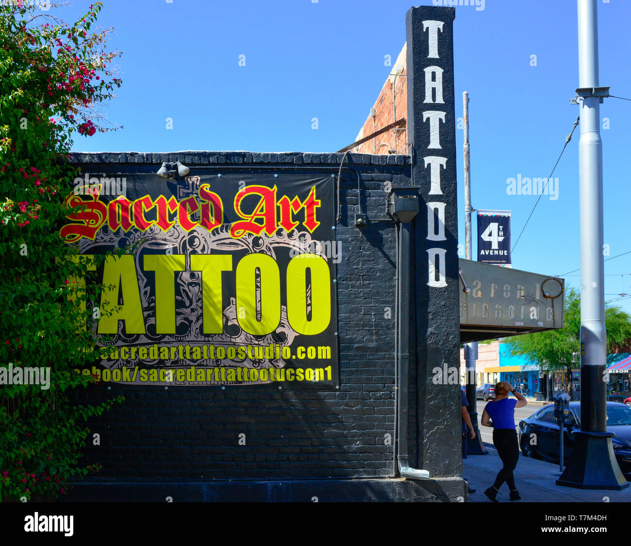 Sacred Art Tattoo Studio Has A Distinctive Black Building With Yellow