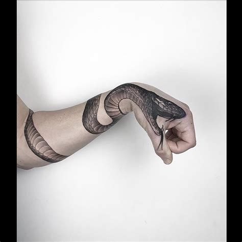 Snake Tattoo On The Arm And The Hand Tattoogrid Net