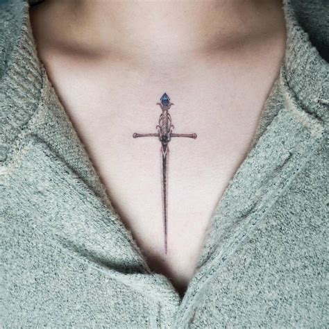 Sword Tattoo Placed On The Chest Micro Realistic